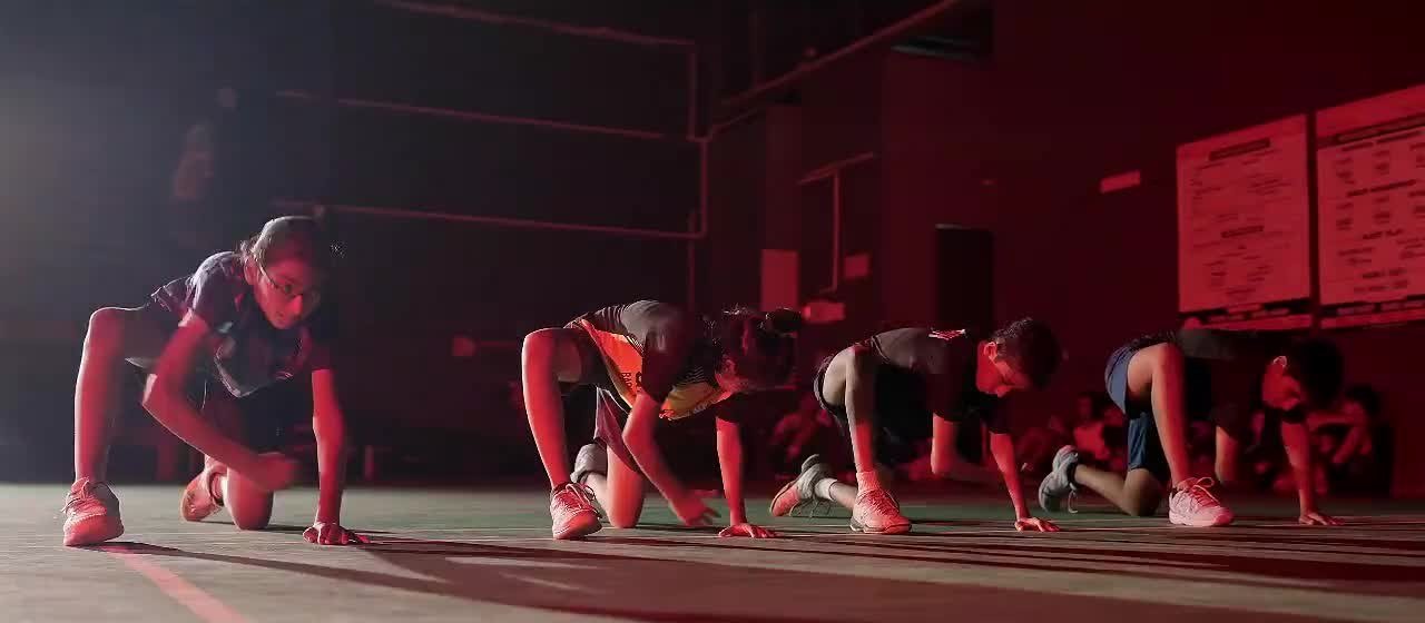 Players practising conditioning drills from the supplied academy video