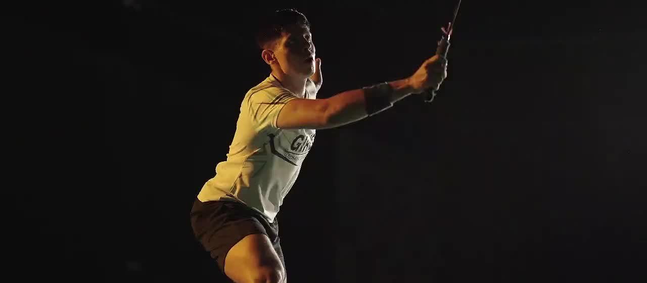 Badminton player preparing a stroke on court